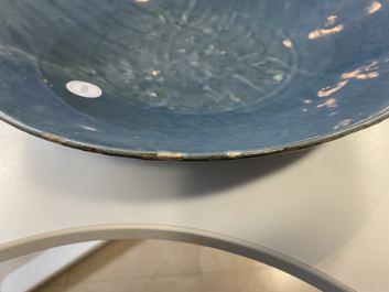 A Chinese monochrome blue Swatow dish with incised carp design, Ming